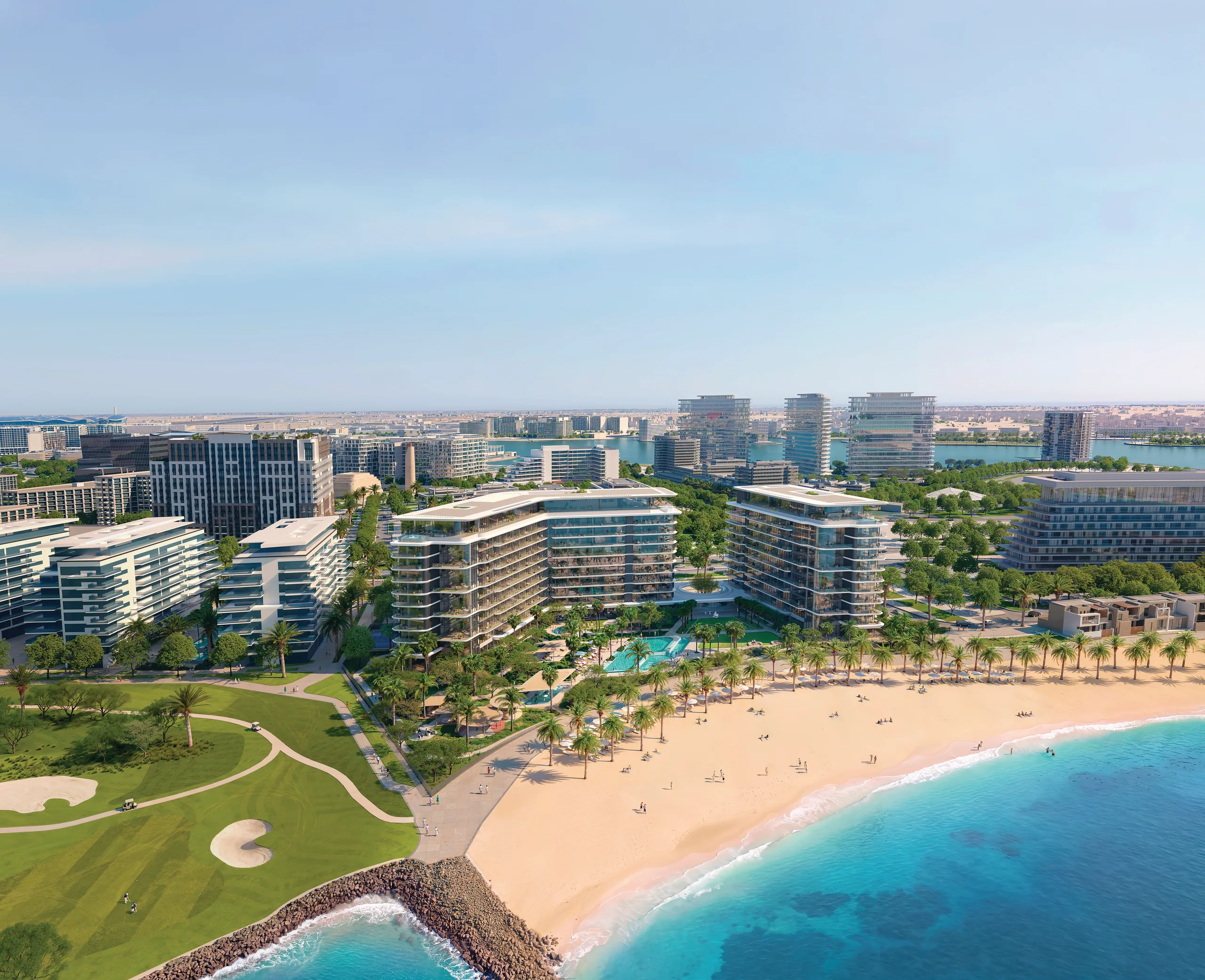 The three residence buildings behind the beach and the pools, the golf course to the left